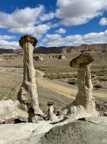 Pair of hoodoos against the blue sky